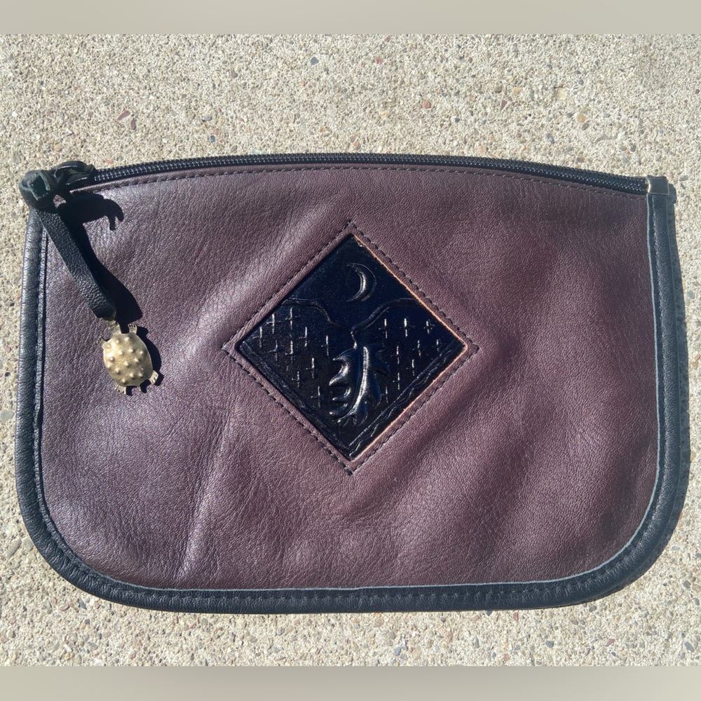Turtle Ridge zipper pouch. Brown/burgundyish color